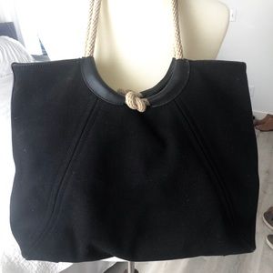 Black Michael Kora purse. Rope handles.